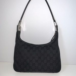 Sold. Gucci gg supreme monogram canvas small black baguette hobo shoulder bag